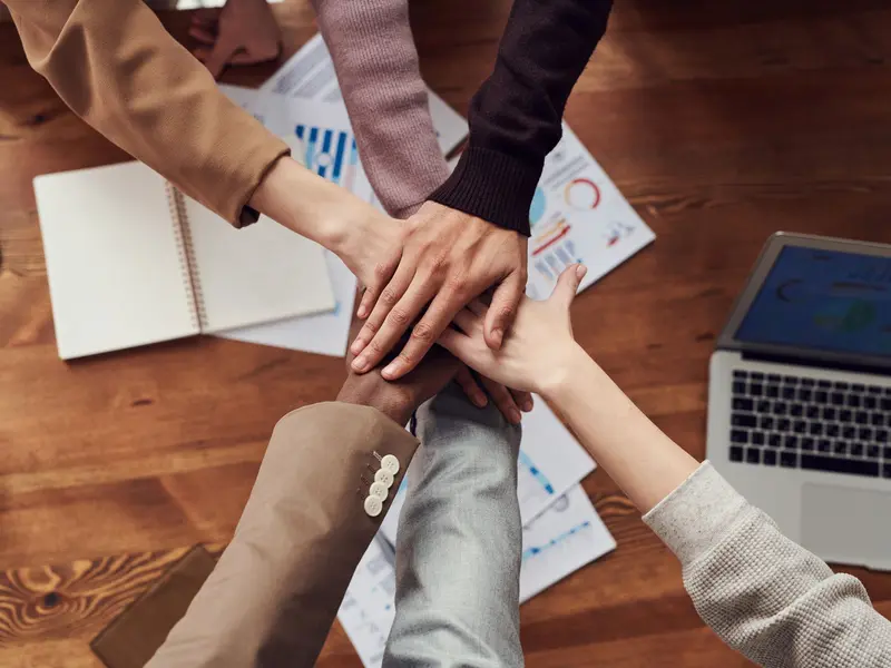 Office team working together at a meeting table